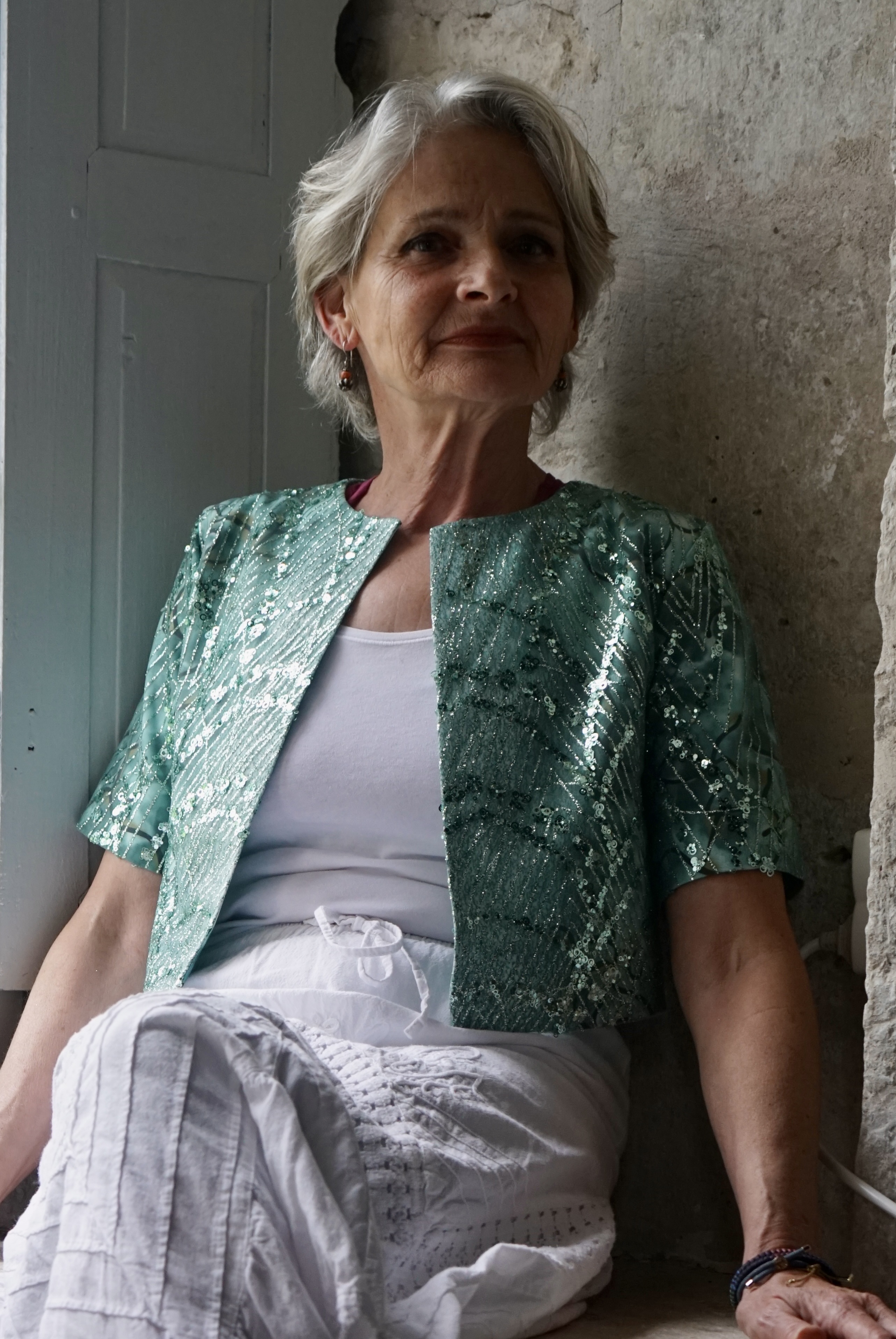 green silvery evening jacket on white