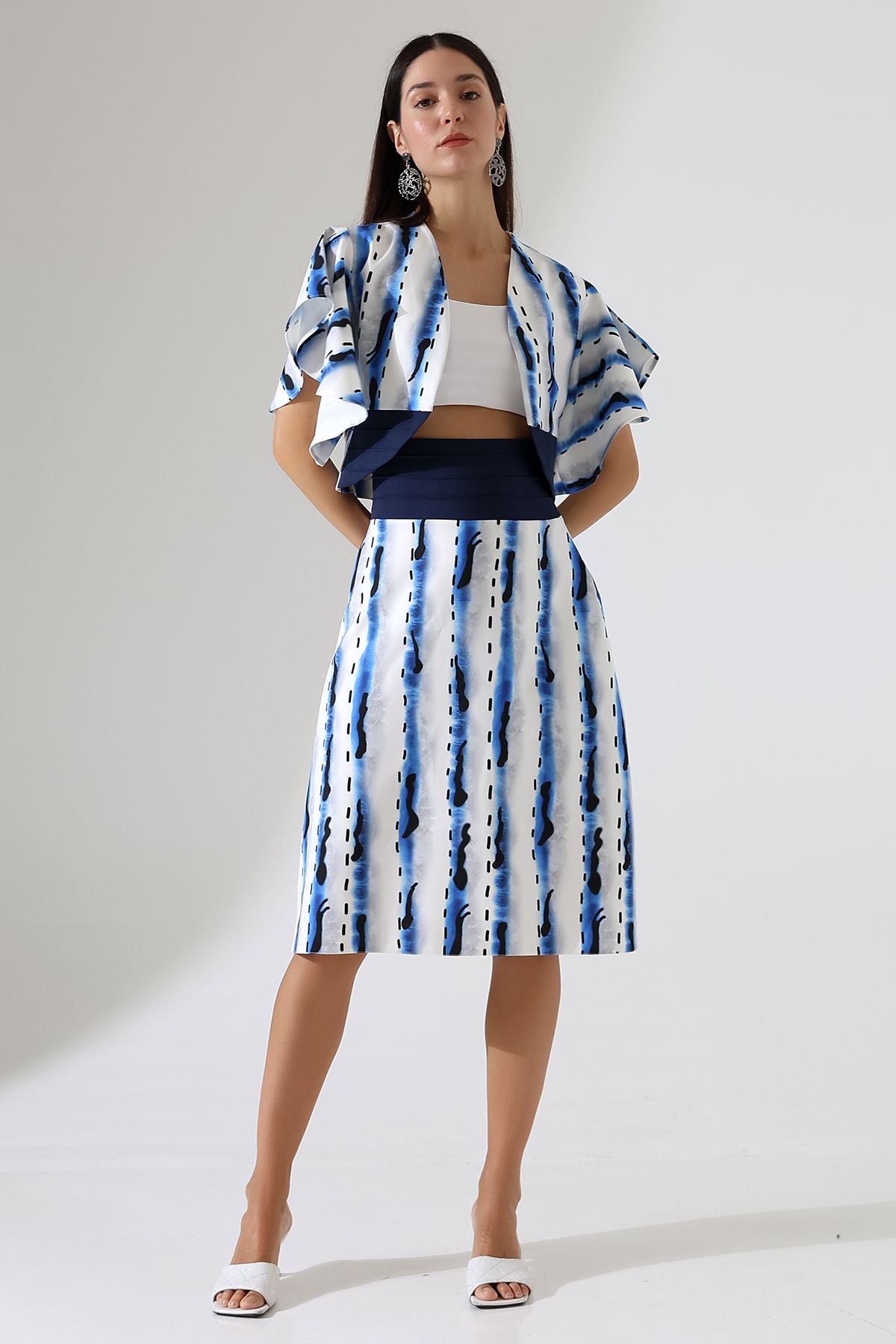 Elegant couture blue and white designer outfit  inspired by flowing river water with bolero jacket and fluid sleeve design, bespoke tailoring 