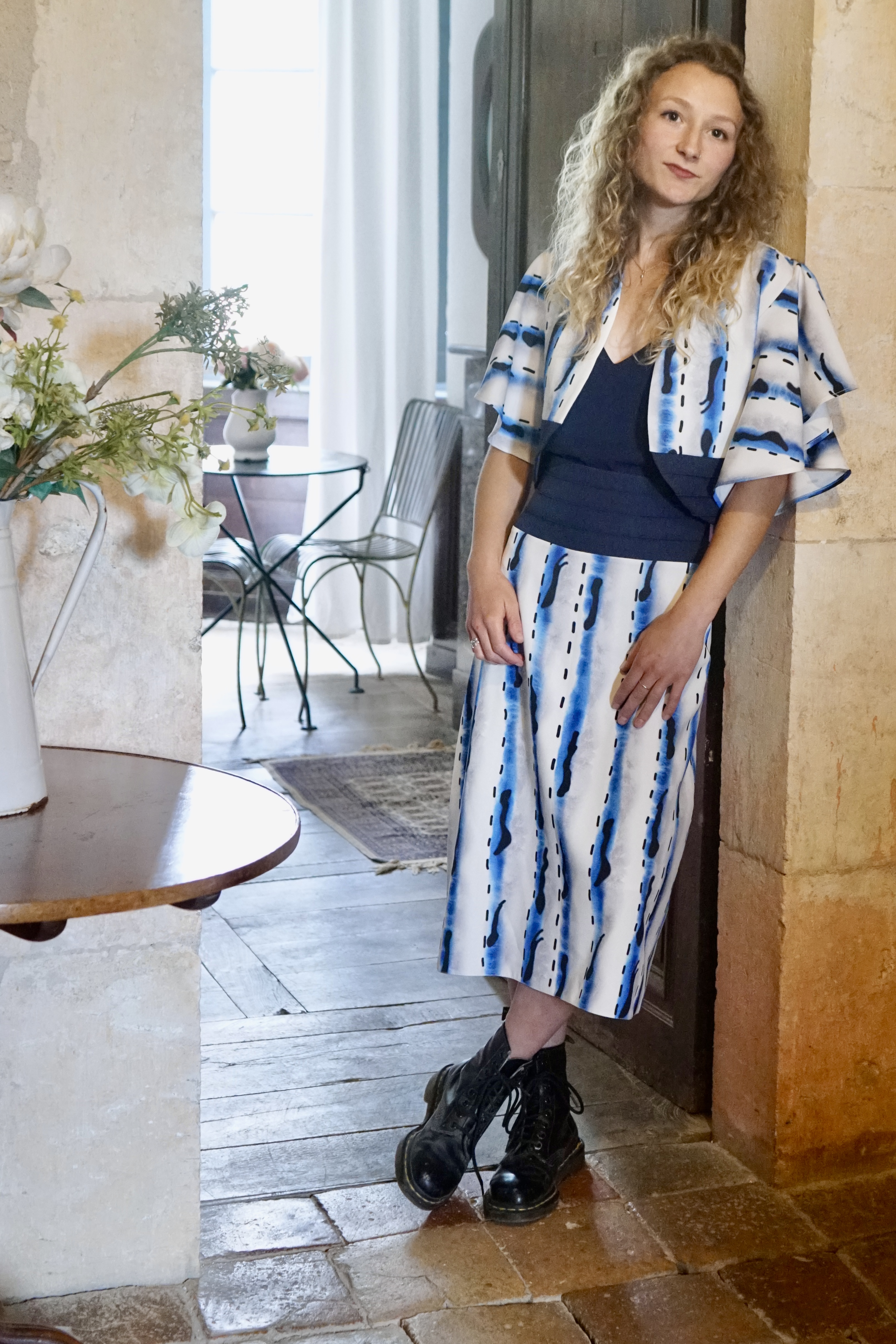 Model in chateau with blue and white  river dress and bolero