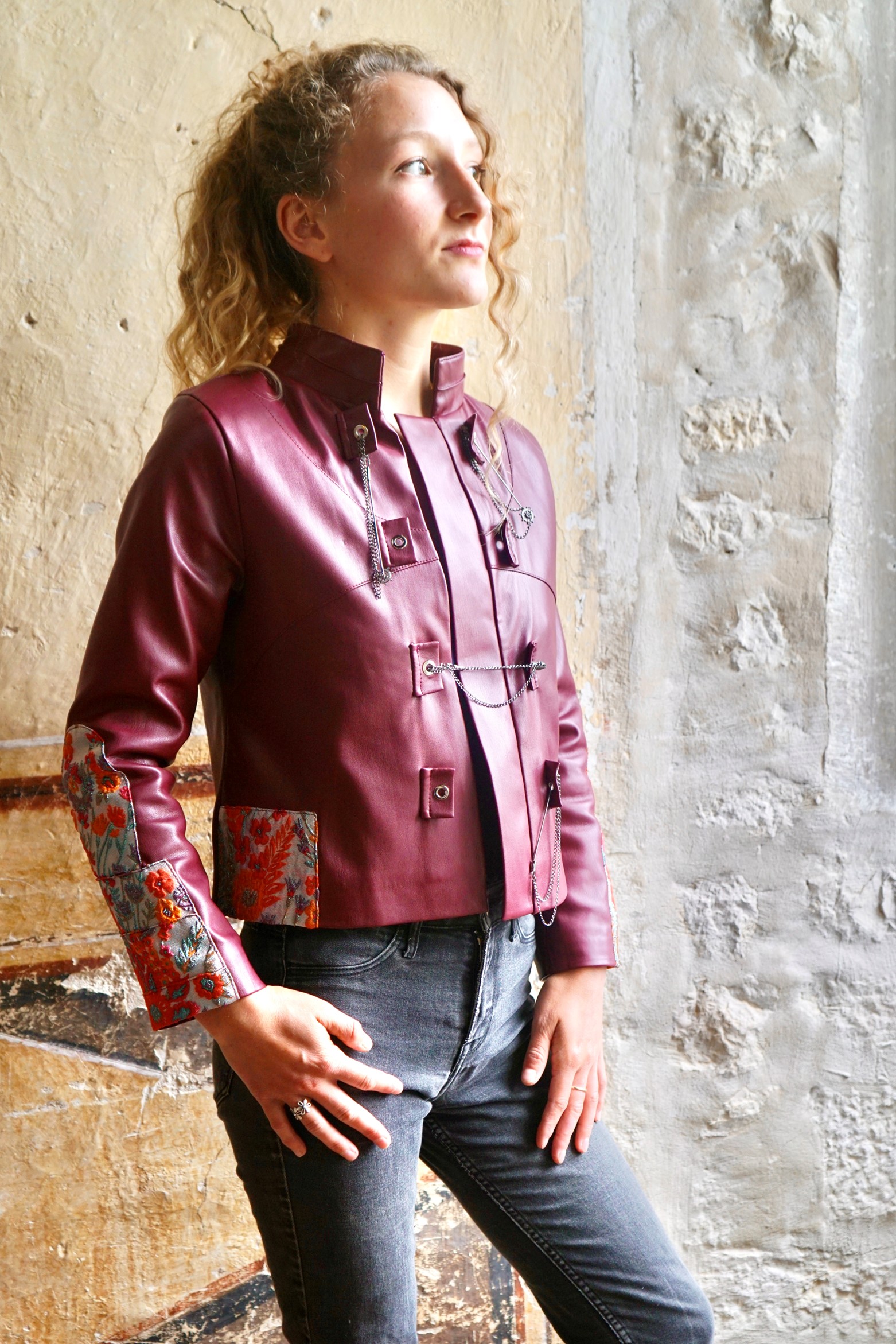 Close up of short leather jacket with unusual trim