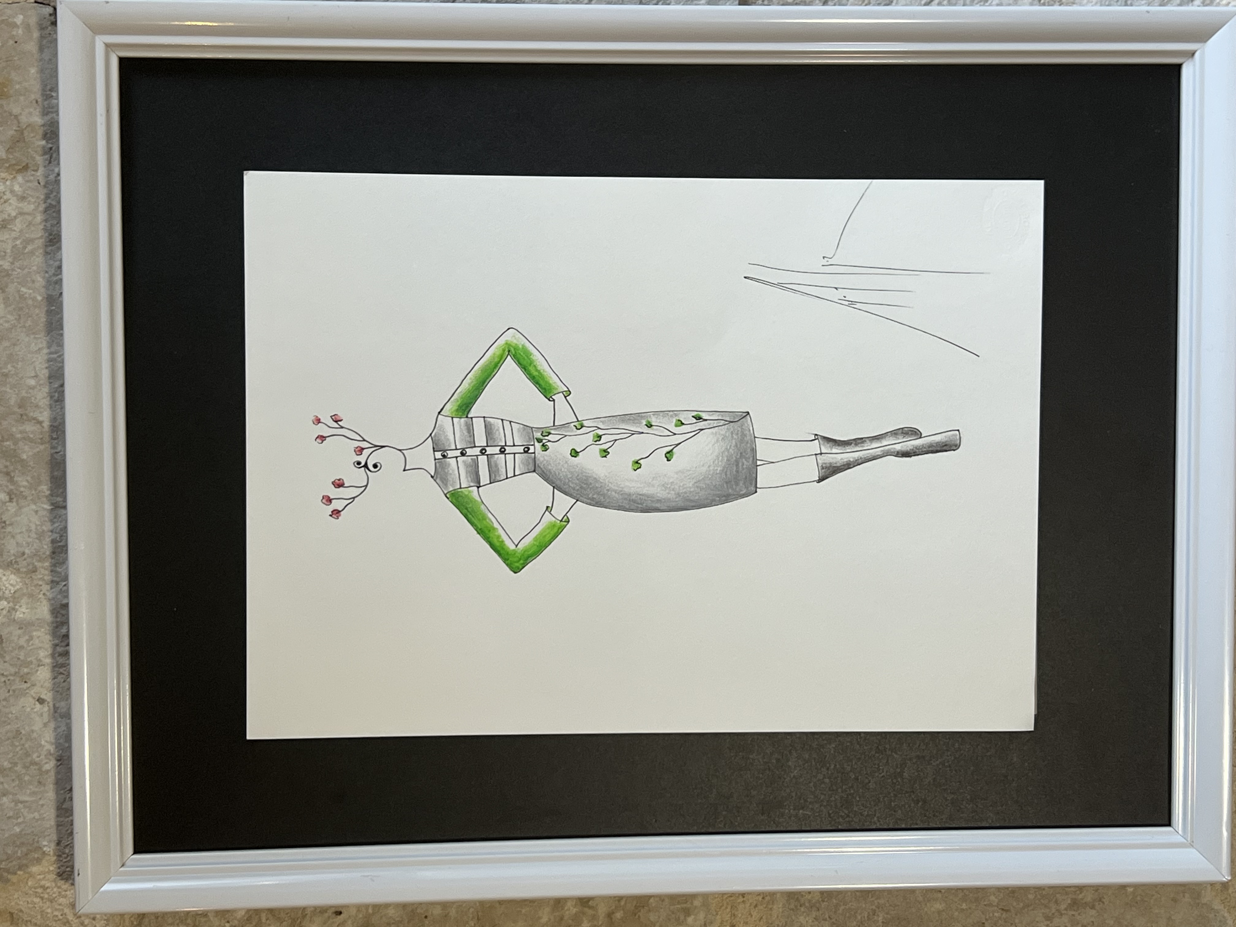 Original haute couture designers drawing of a dress with green sleeves and a delicate tendril of leaves on a grey dress