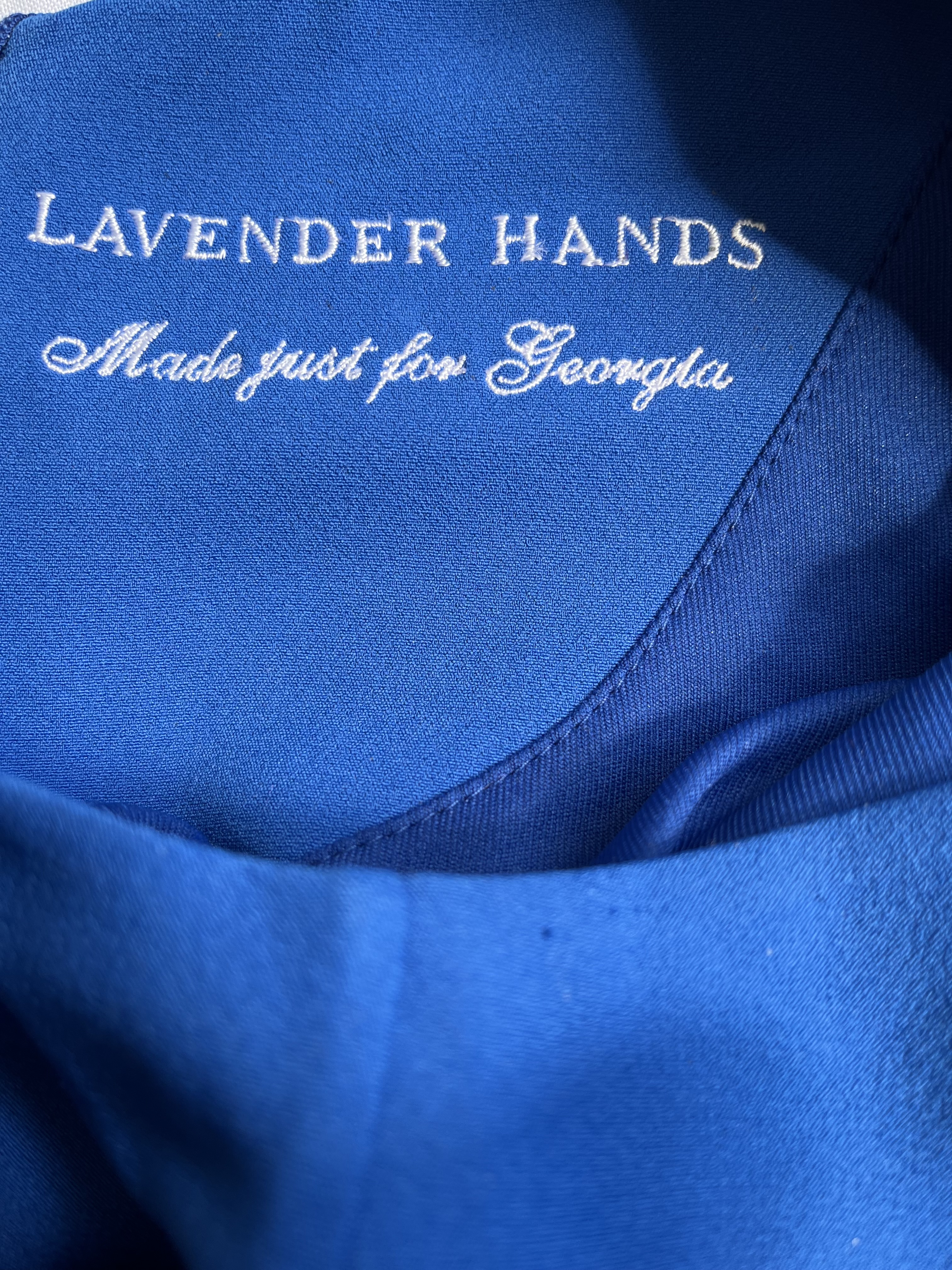 Photo of personalised label on blue dress