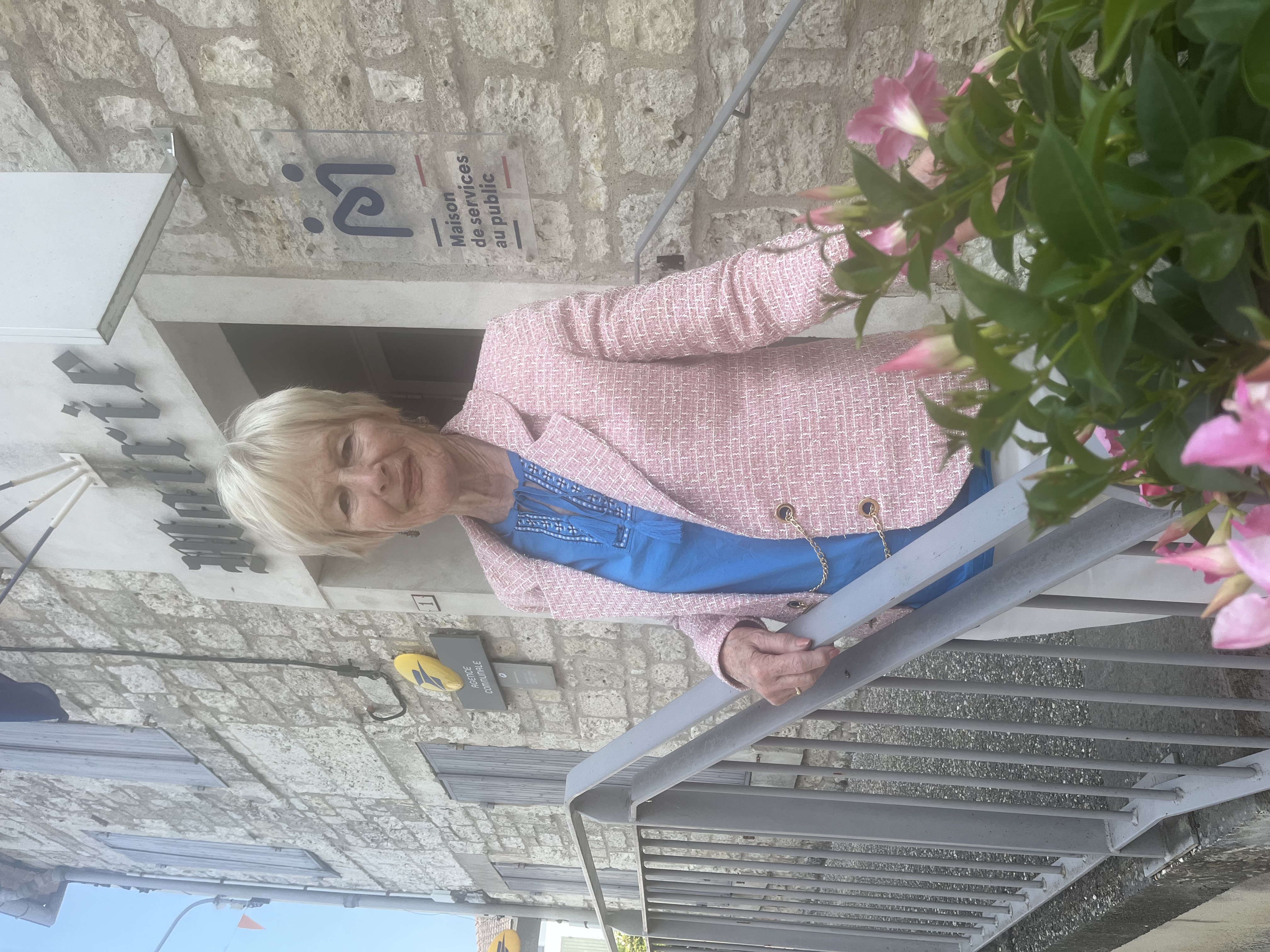 A customer wearing the pink woven jacket